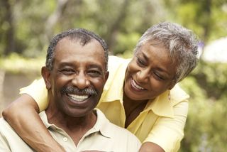 A smiling, happy senior couple.