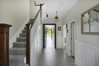 updated staircase with stair runner in a modern home