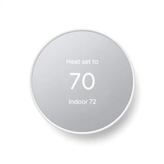 A circular white and grey smart thermostat with the number 70 displayed on it