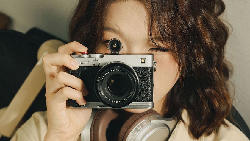 Lifestyle image of person using camera with SmallRig Camera 28mm External Optical Viewfinder attached 