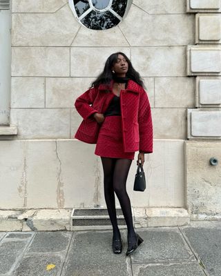 Emmanuelle wearing red and black