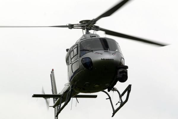 A television helicopter hovers above Amsterdam on Sunday morning