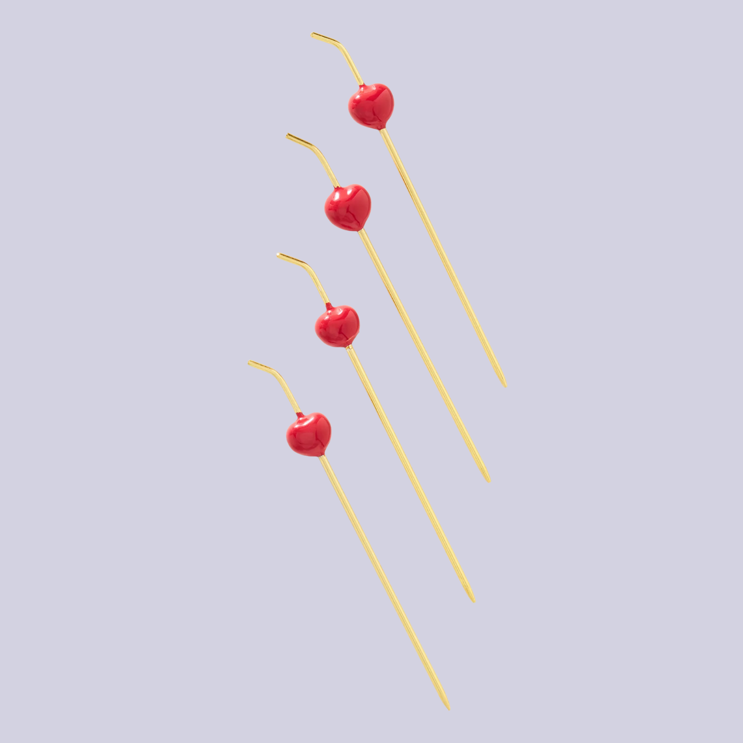 A set of four gold and red cocktail picks