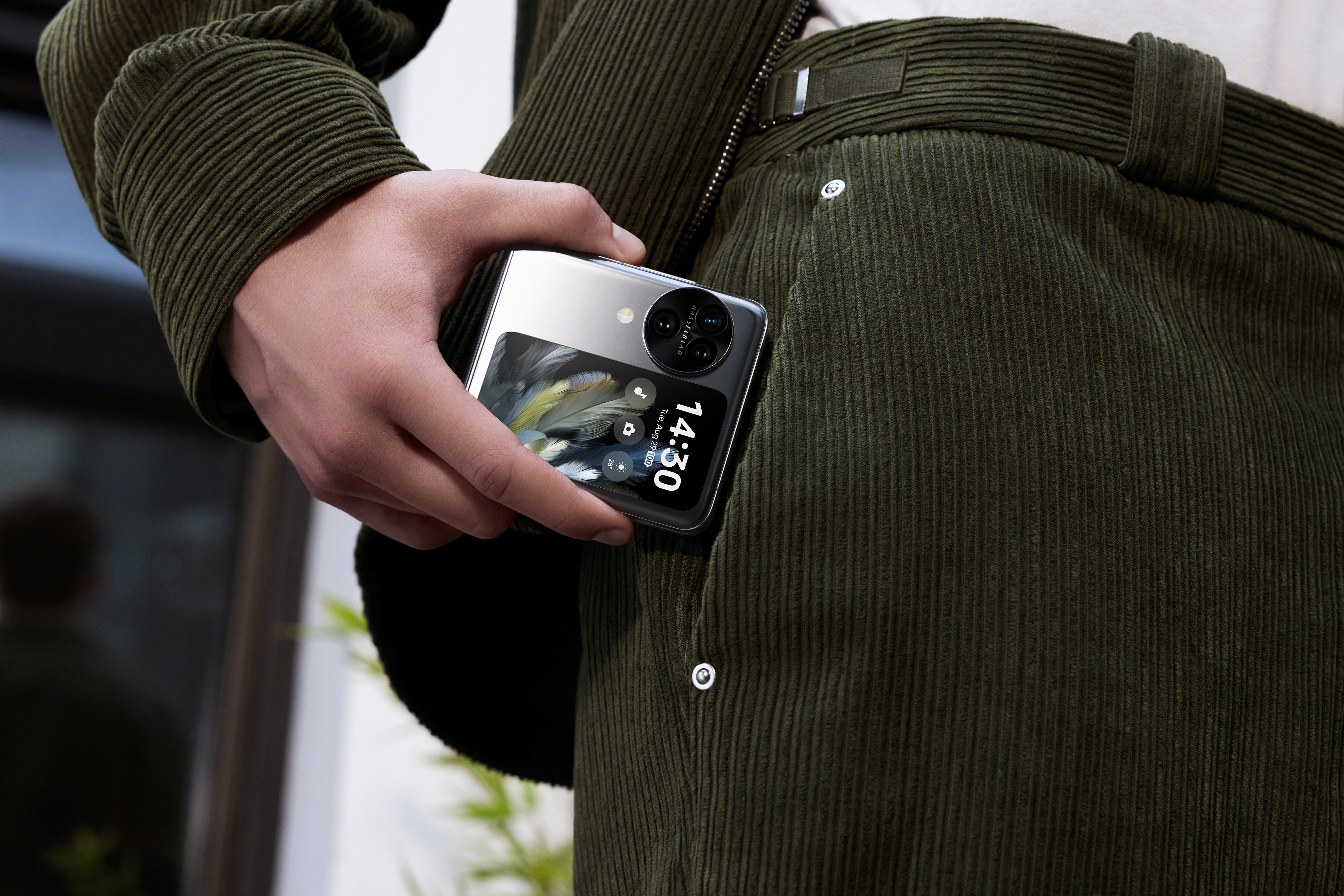 Oppo flip phone in a mans pocket