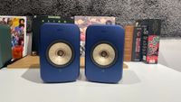 KEF LSX II speakers in blue finish on desk