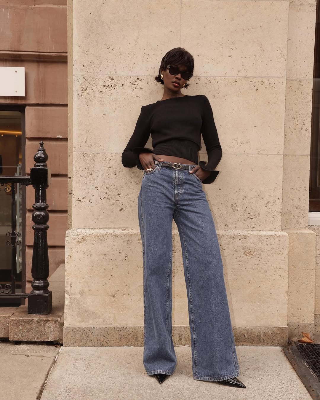 woman wearing black pointed toe heels jeans fall outfits 2025