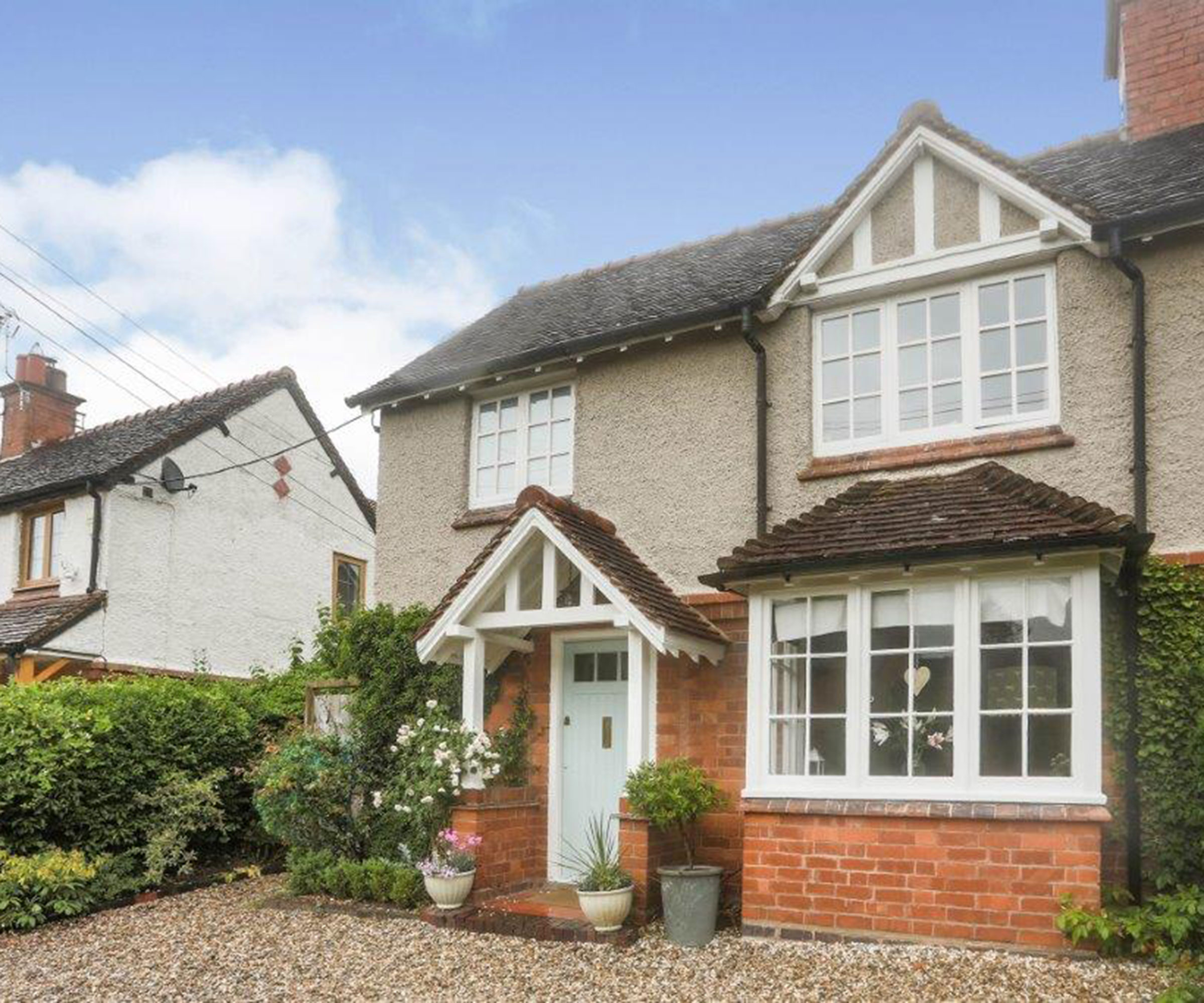 semi-detached Edwardian house with gravel driveway