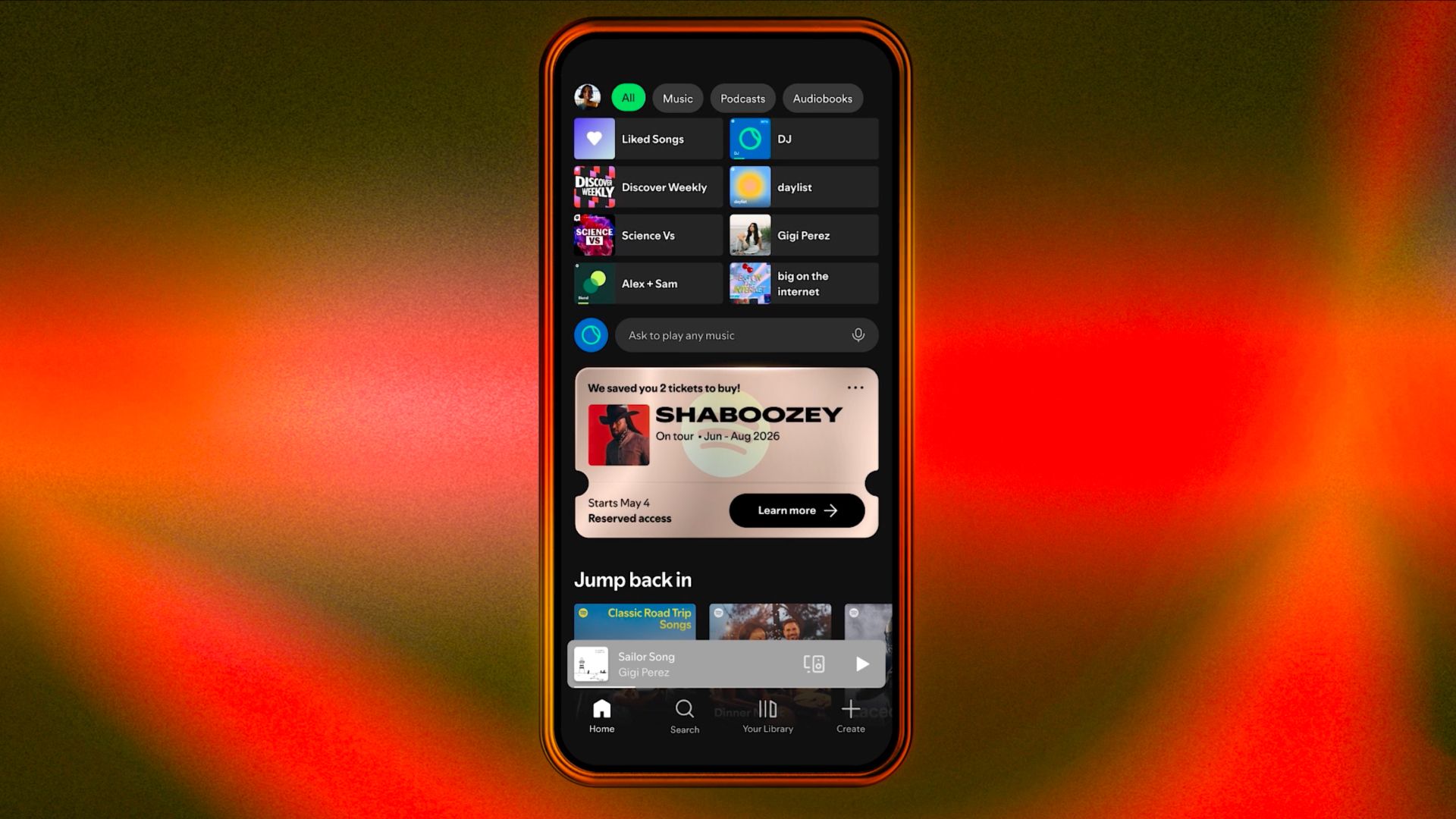 Un teléfono mostrando la página principal de Spotify con un popup de entradas de conciertos reservadas