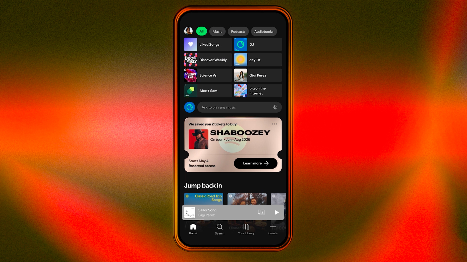 A smartphone showing the Spotify home page with a pop-up showing reserved concert tickets