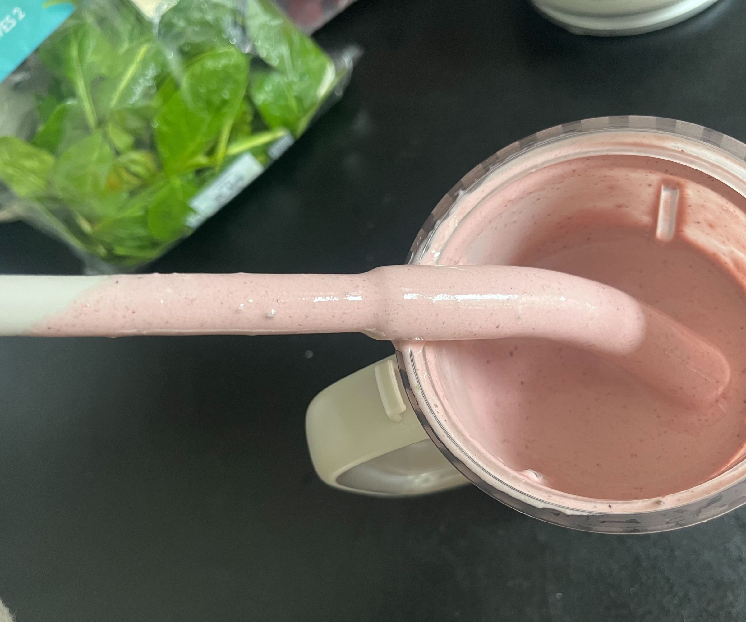 A close up of the smoothie mix on a straw, with some seeds visible in the texture