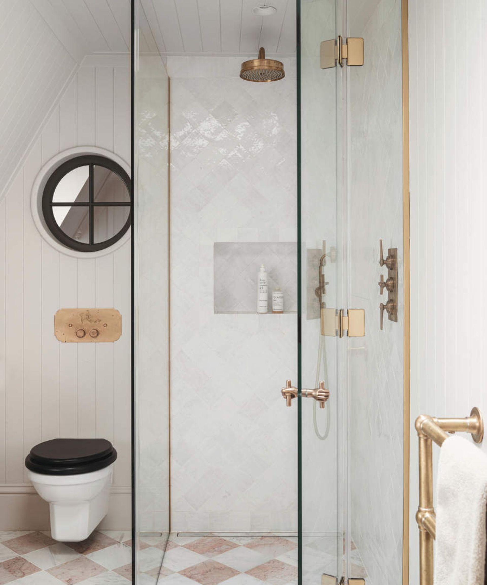 Toilet, pink and white tile floor