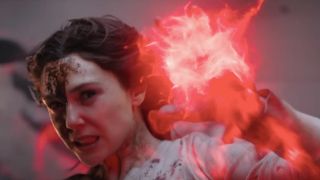 A bloodied Elizabeth Olsen charging her magic attack in Doctor Strange in the Multiverse of Madness.