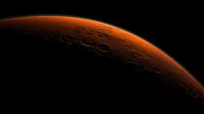 An artist's illustration of Mars's Gale Crater beginning to catch the morning light.