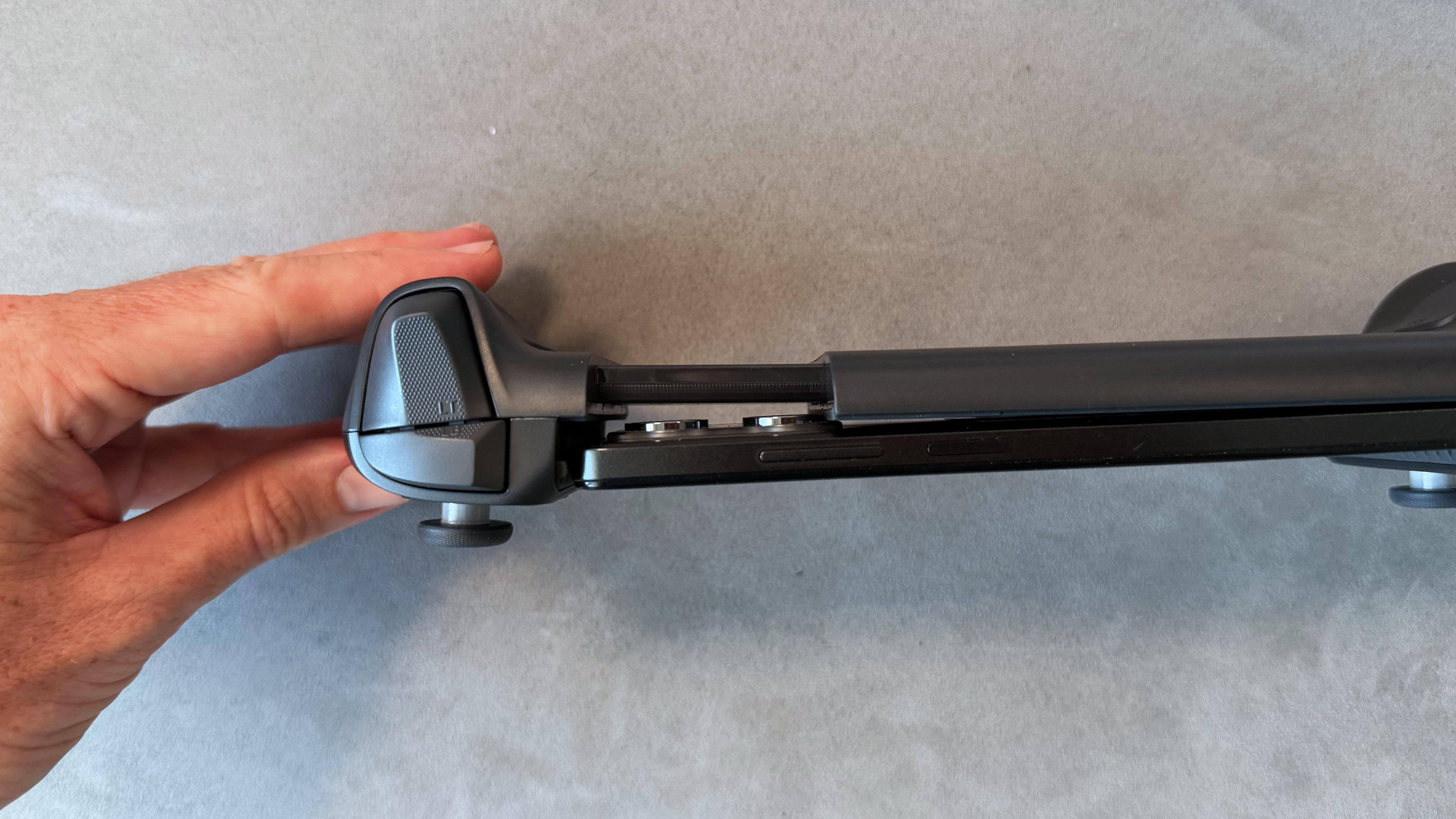 A black model of the GameSir G8 Plus Bluetooth mobile controller on a clean grey surface.