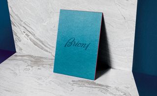 silky, pearlescent teal offering, edged in Brioni’s signature red