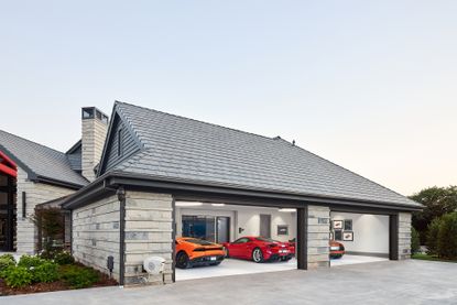 a garage with red and orange sports cars