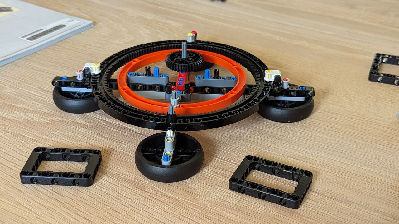 Lego technic planet earth and moon in orbit set on a white background