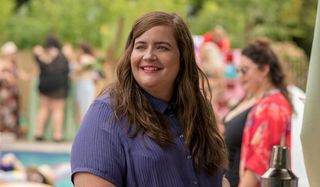 Shrill Aidy Bryant smiling by the pool