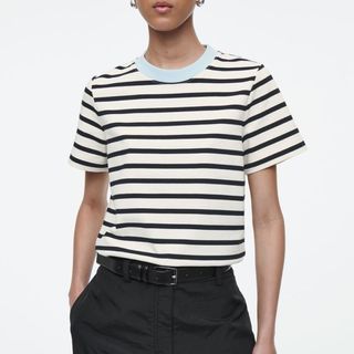 image of woman wearing black and white stripe t-shirt