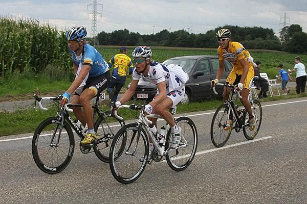 Riders take on some refreshments at the feed zone.