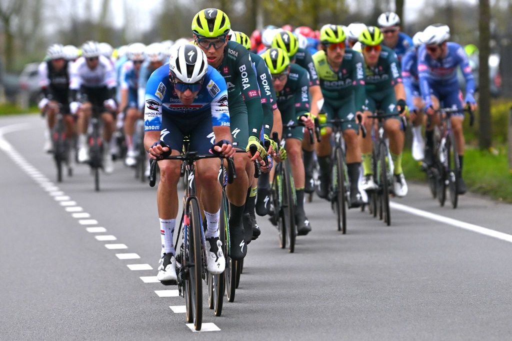 SCHOTEN BELGIUM APRIL 03 LR Warre Vangheluwe of Belgium and Team Soudal QuickStep and Filip Maciejuk of Poland and Team BORA hansgrohe lead the peloton during the 112th Scheldeprijs 2024 Mens Elite a 2053km one day race from Terneuzen to Schoten on April 03 2024 in Schoten Belgium Photo by Luc ClaessenGetty Images