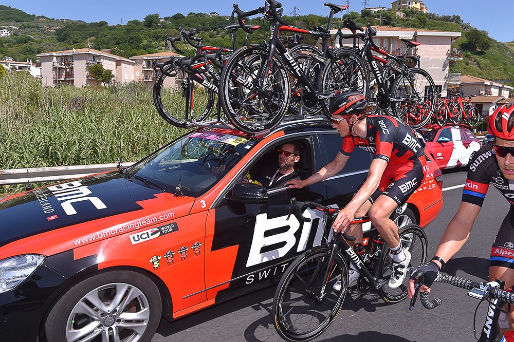 A BMC rider chats at the team car during the Giro's fourth stage.