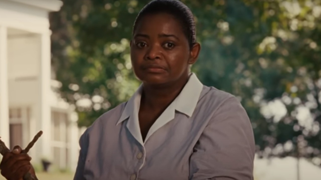 Octavia Spencer defending herself with a stick in The Help