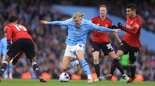 Erling Haaland on the ball for Manchester City against Manchester United in the Premier League in March 2024.
