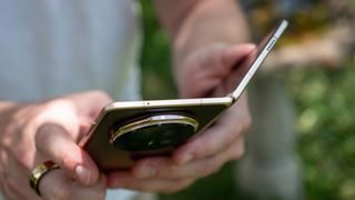 Holding a gold Honor Magic V5