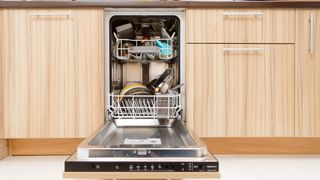 Open dishwasher with dishes in kitchen
