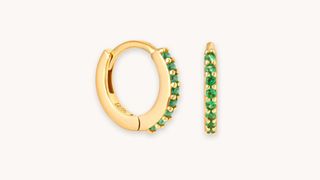 A pair of gold birthstone hoops, one of the best personalized jewelry gifts.