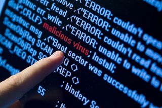 Finger pointing towards malware on a piece of code