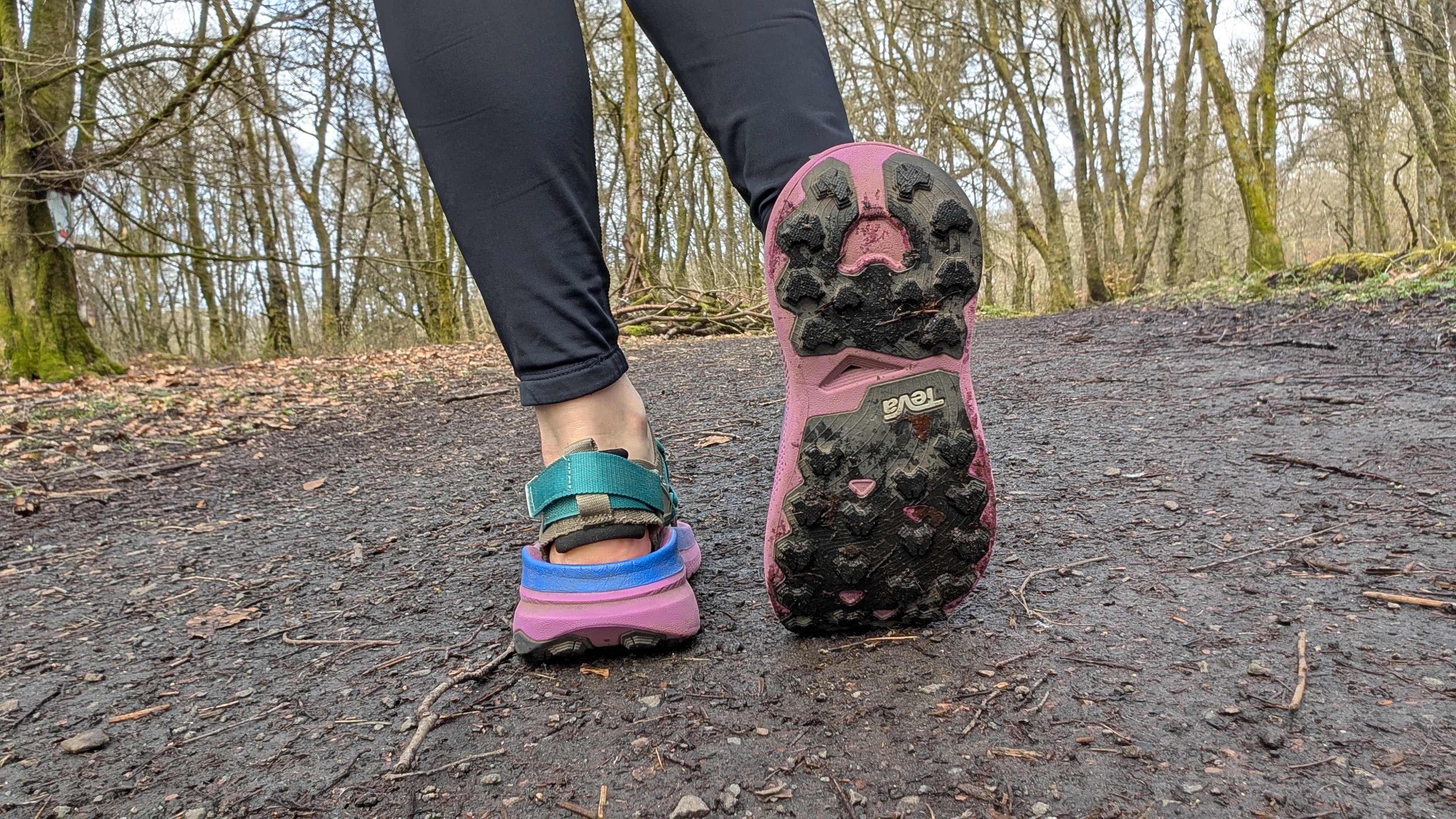 A runner's feet showing the sole of the Teva Aventrail running sandals