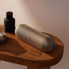 beats by dre pill speaker on wooden table