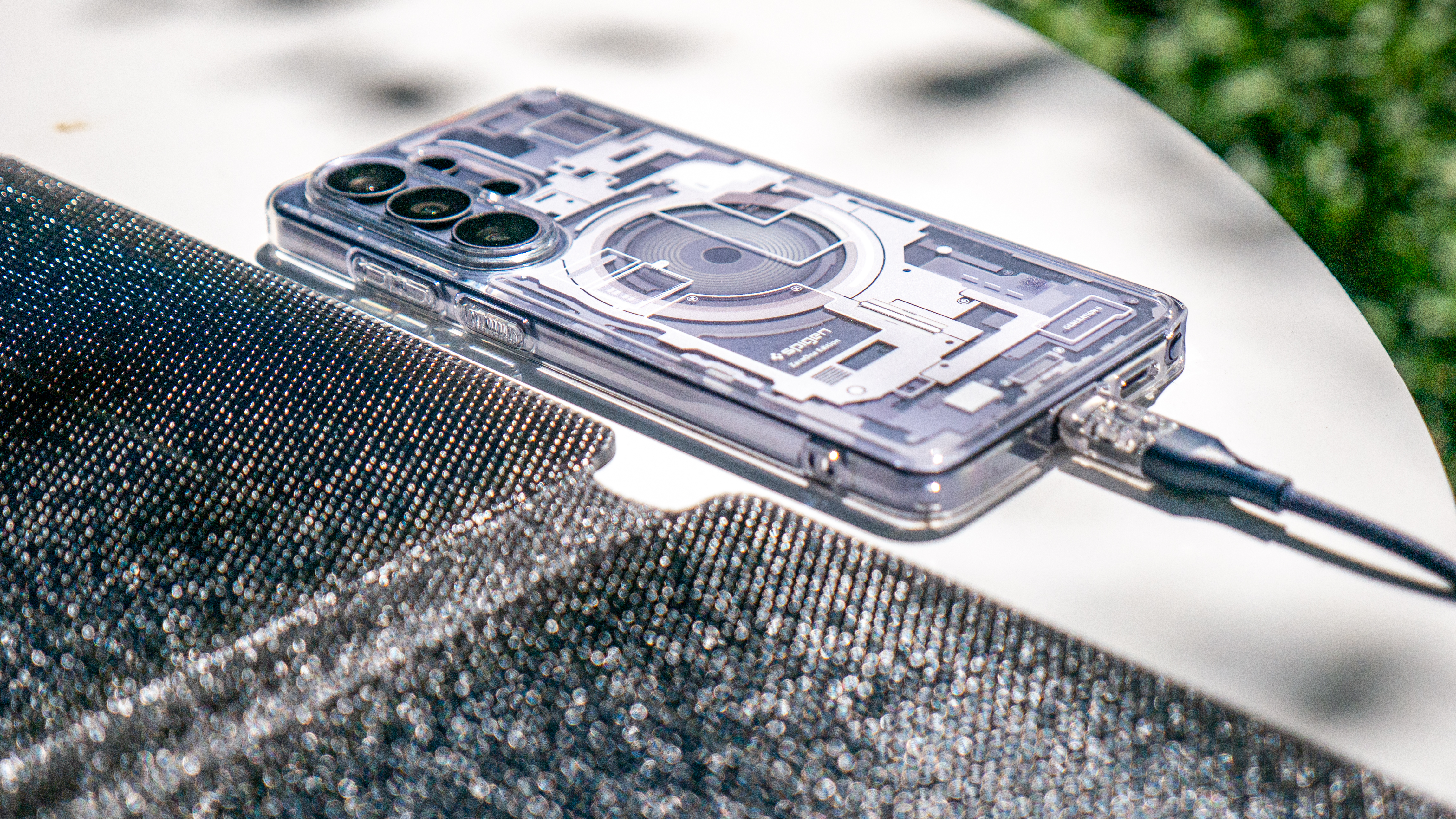 Duracell M-Series Portable Solar Panel charging a phone.