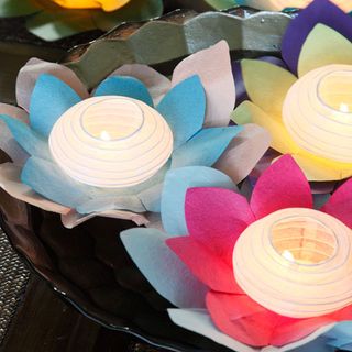 float lantern candles on shallow bowls