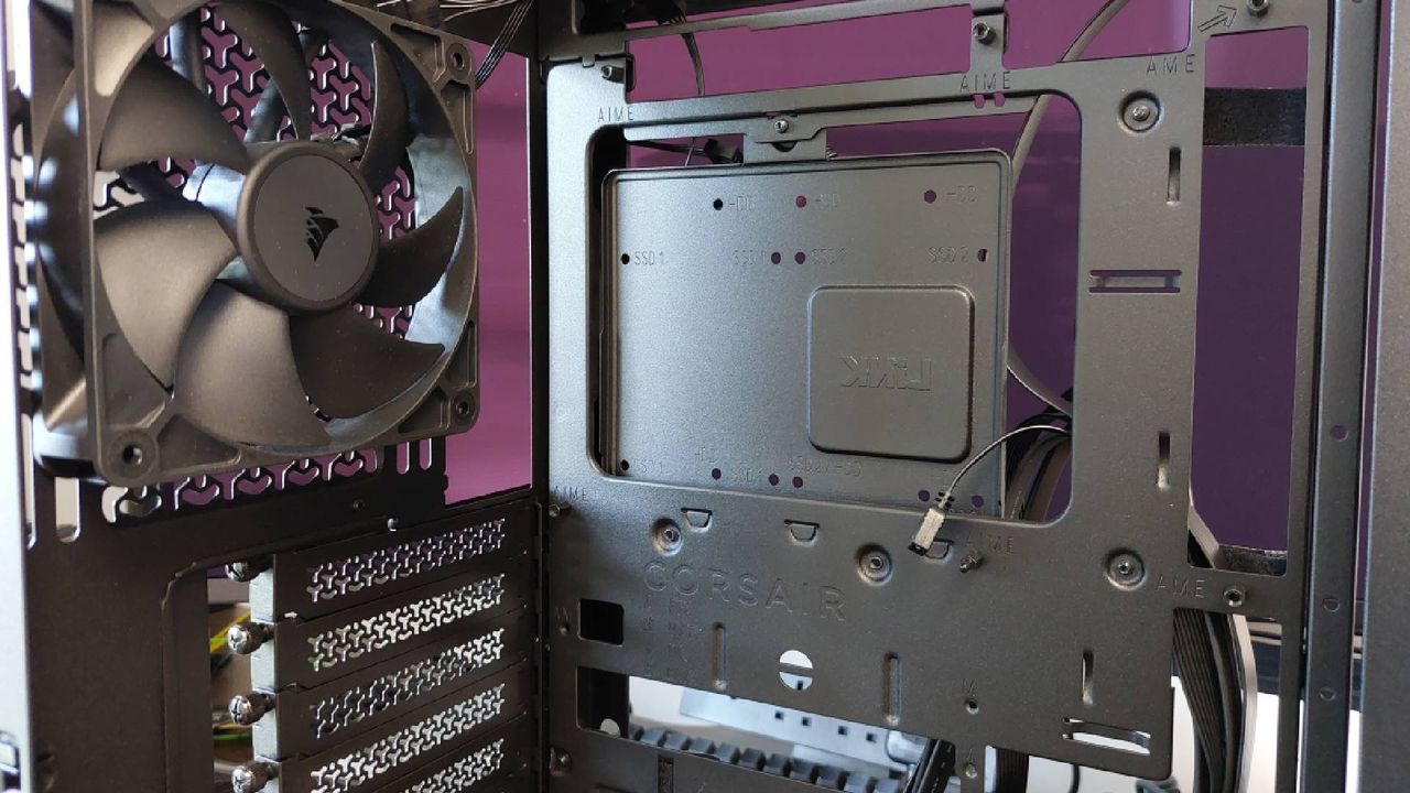 The Corsair Frame 4000X PC case seen at various stages of a PC build. This is a modular, mid-tower case with lots of options for customisation.