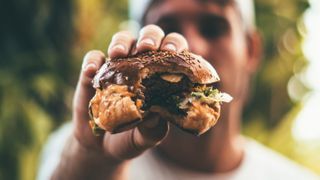 Man holding a burger