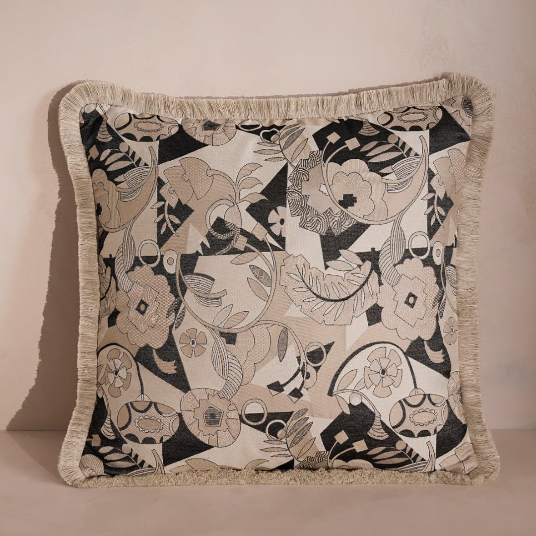 a black and white throw pillow with an abstract design