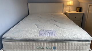 The Sleepeezee Cool Rest 1800 Mattress on the bed frame in our reviewer's bedroom