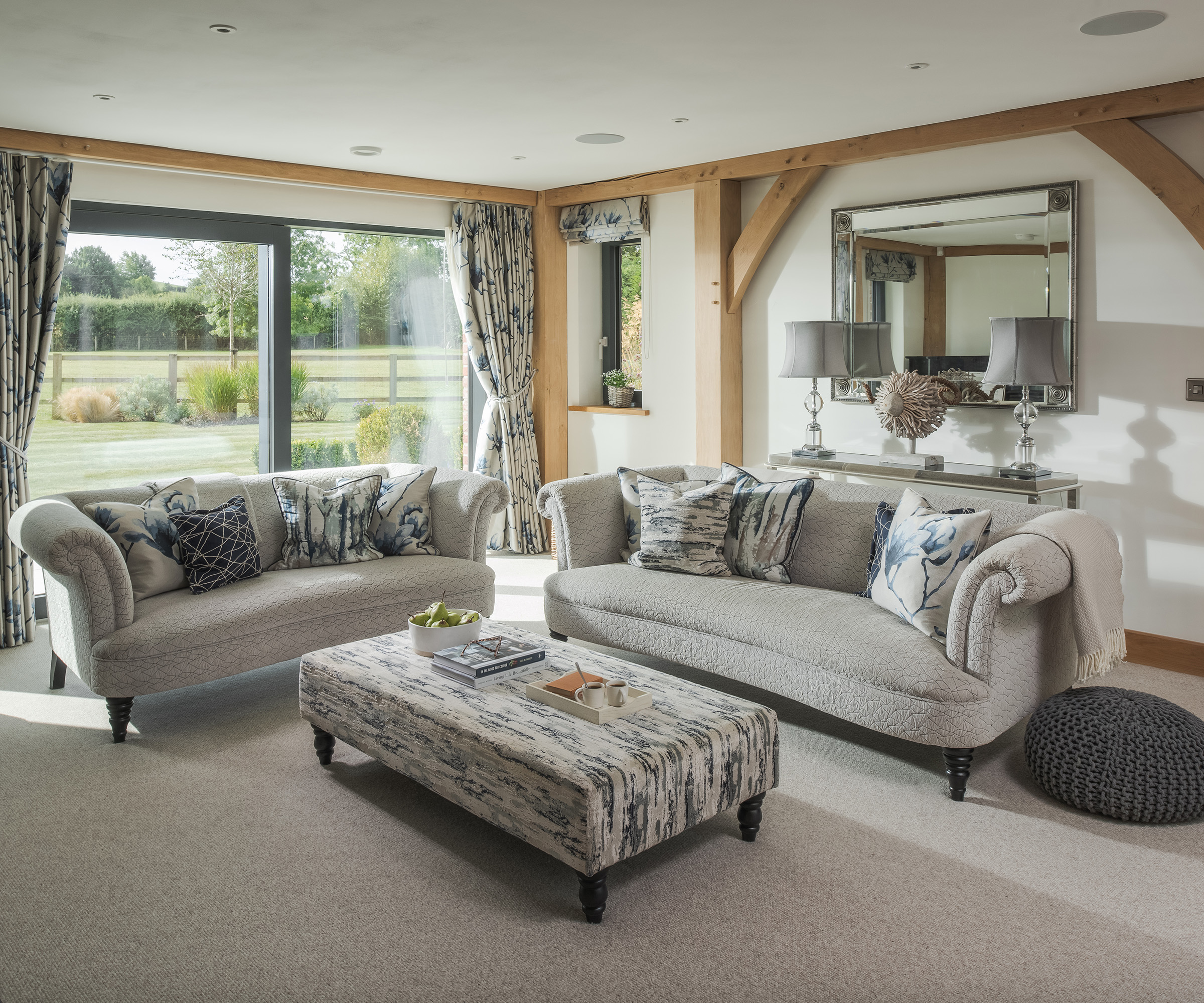 Two plush sofas in the living room of an oak frame self build home