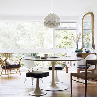 dining area with wooden flooring and floor to ceiling windows