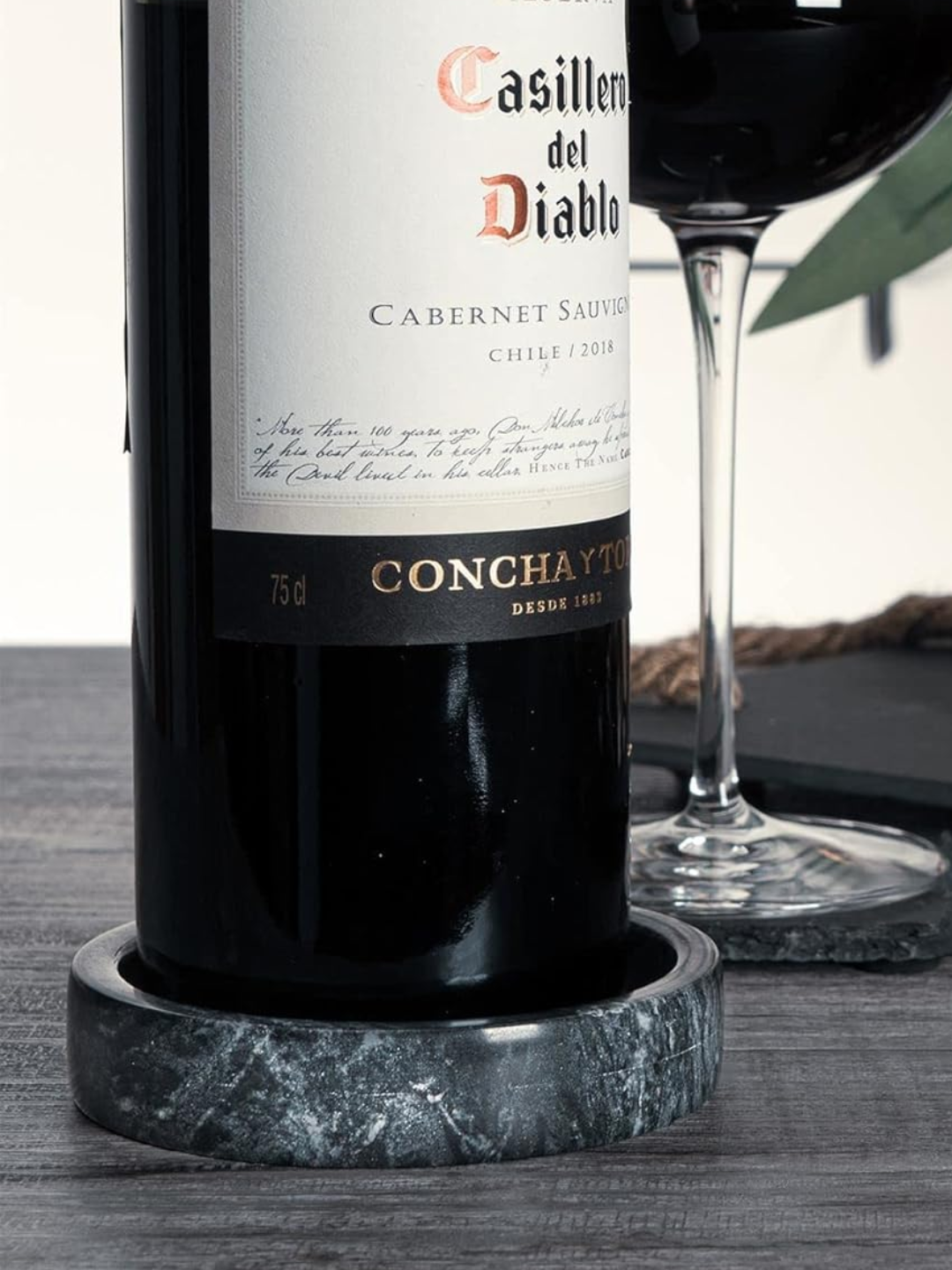 A dark marble wine coaster from Argon on Amazon
