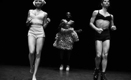 Three women are dancing on the stage