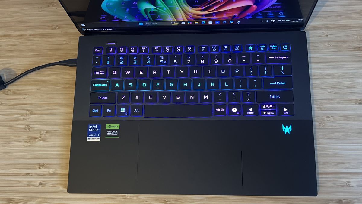 Top down view of Acer Predator Triton 14 AI gaming laptop showing keyboard with RGB lighting