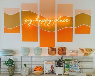 Playful kitchen with neon light typography signage in orange