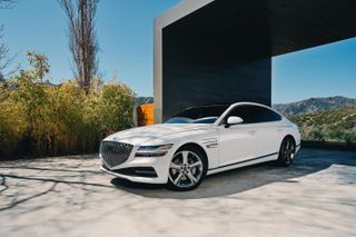 Genesis G80 exterior view with architeture in the background