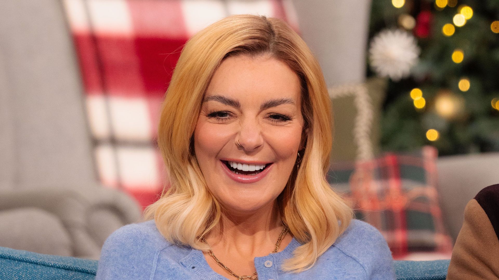 Sheridan Smith wearing blue cardigan and brown satin maxi skirt on This Morning, 04 December 2025