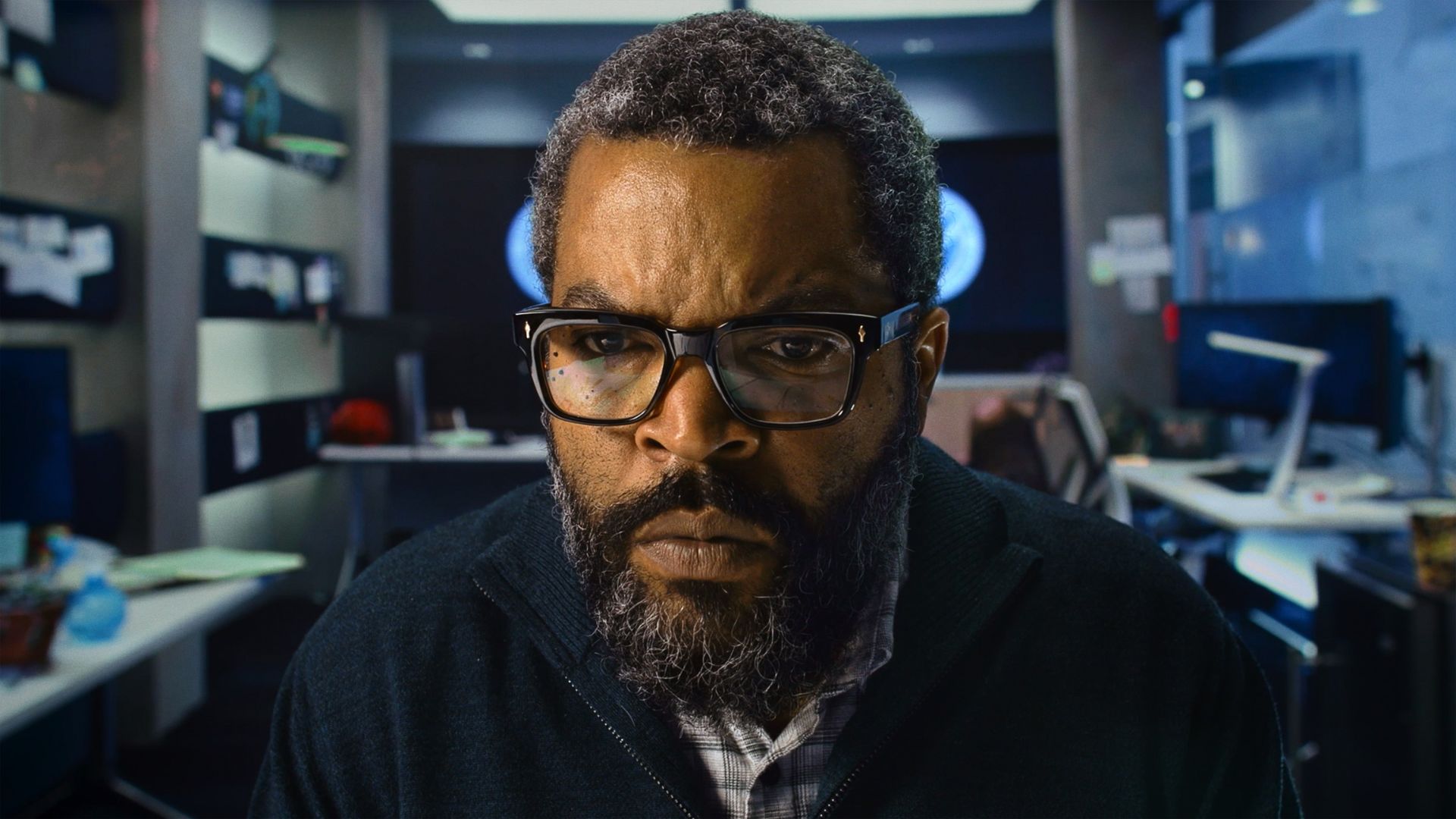 Ice Cube sits in a computer lab looking concerned