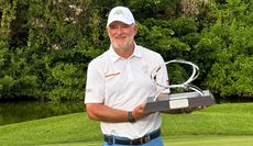Peter Baker holds the MCB Tour Championship trophy